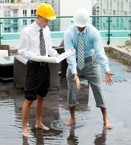 Roof Leak Detection technicians performing a field roof survey